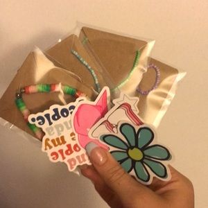 BRAND NEW bracelets, 1 homemade bracelet + one free sticker